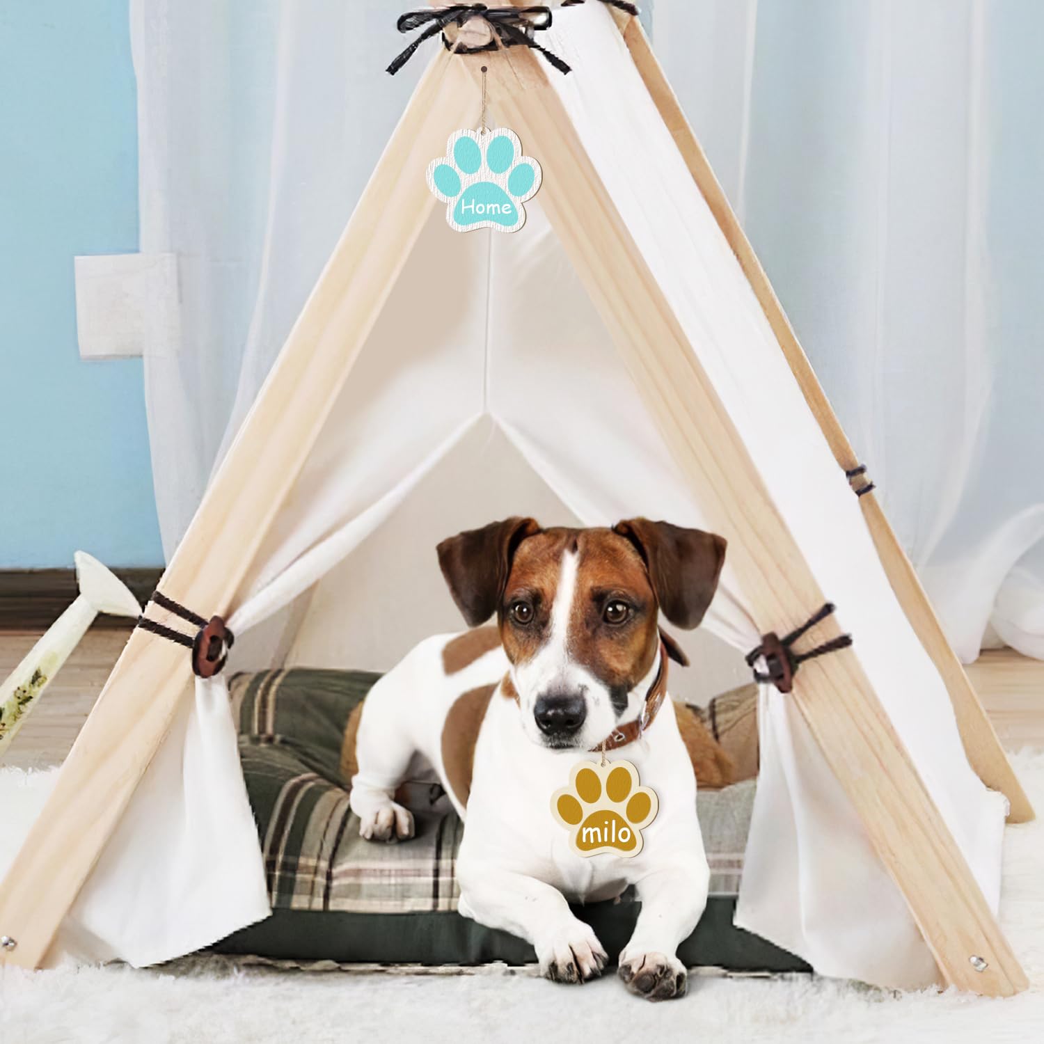 Dog inside a pet teepee with 'milo' branding on a cushion.