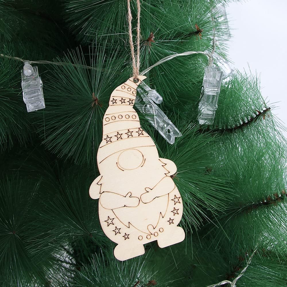 Wooden gnome ornament hanging on a Christmas tree with decorative lights.