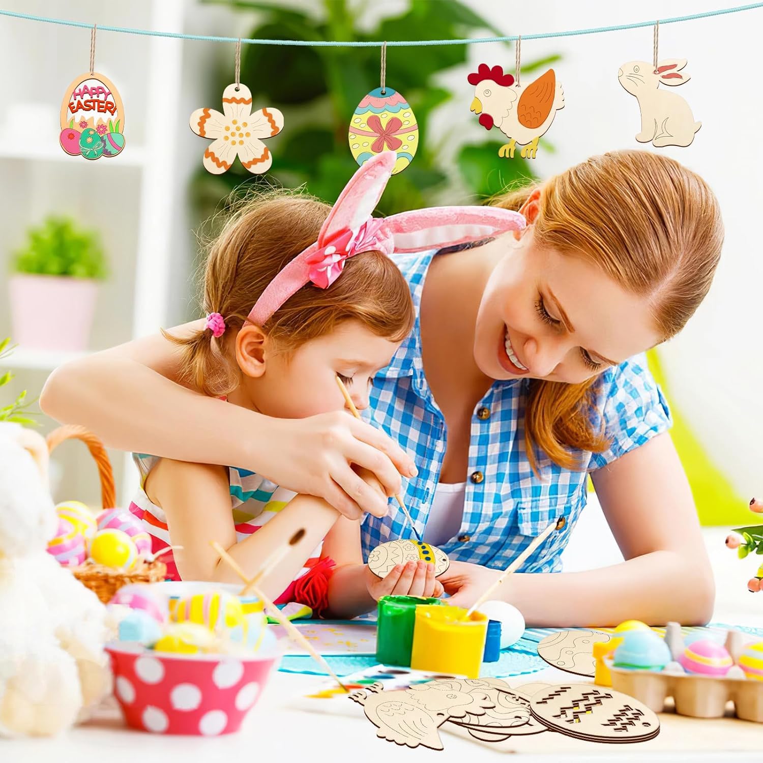 Woman and child making crafts together with Easter-themed decorations in the background