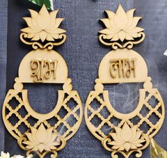 Pair of decorative earrings with lotus designs and text on a dark background