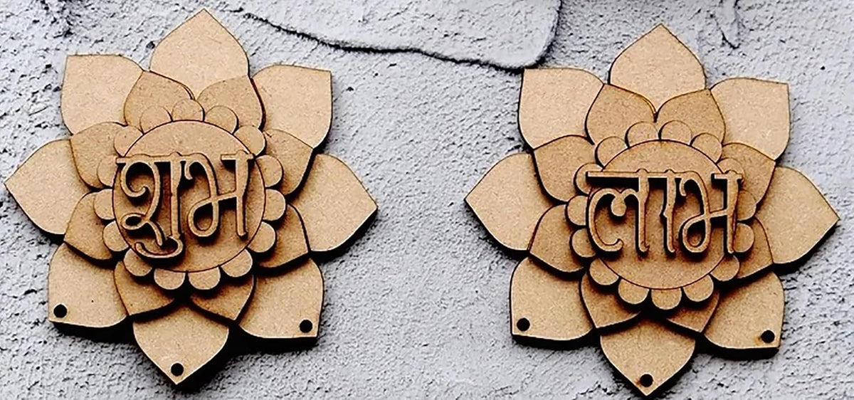 Two wooden lotus-shaped decorations with engraved text on a textured gray surface