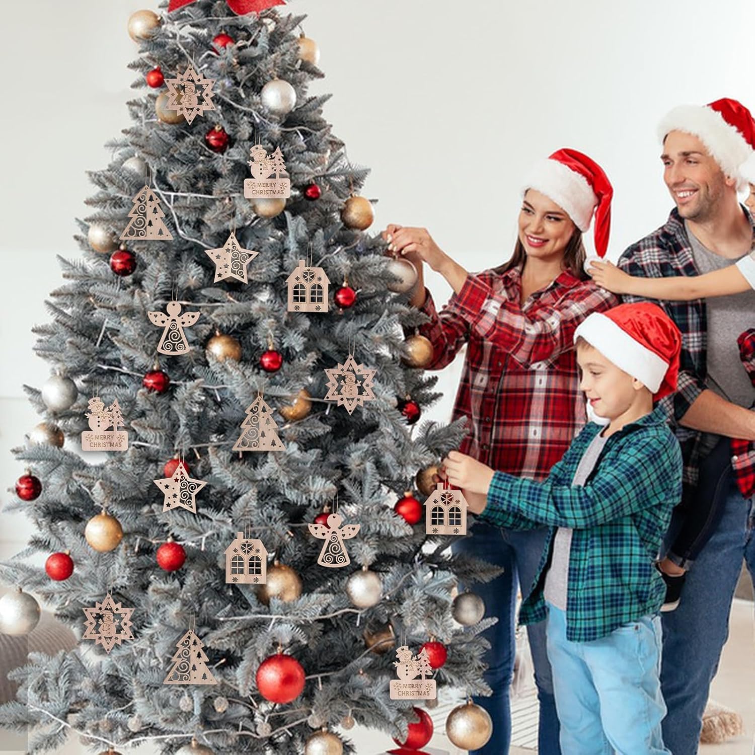 Family decorating a Christmas tree with wooden ornaments.