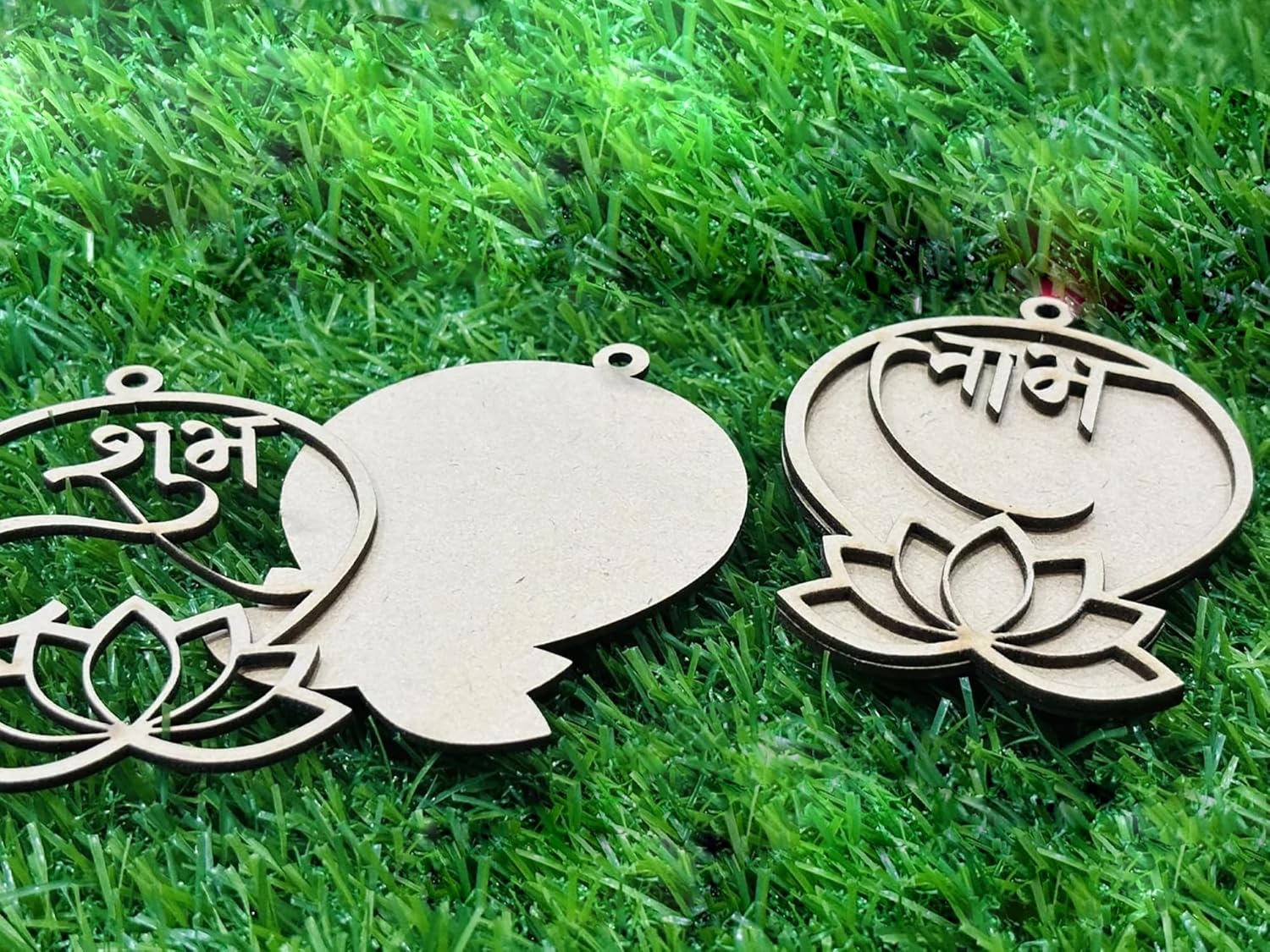 Wooden ornaments with lotus designs on a grass background