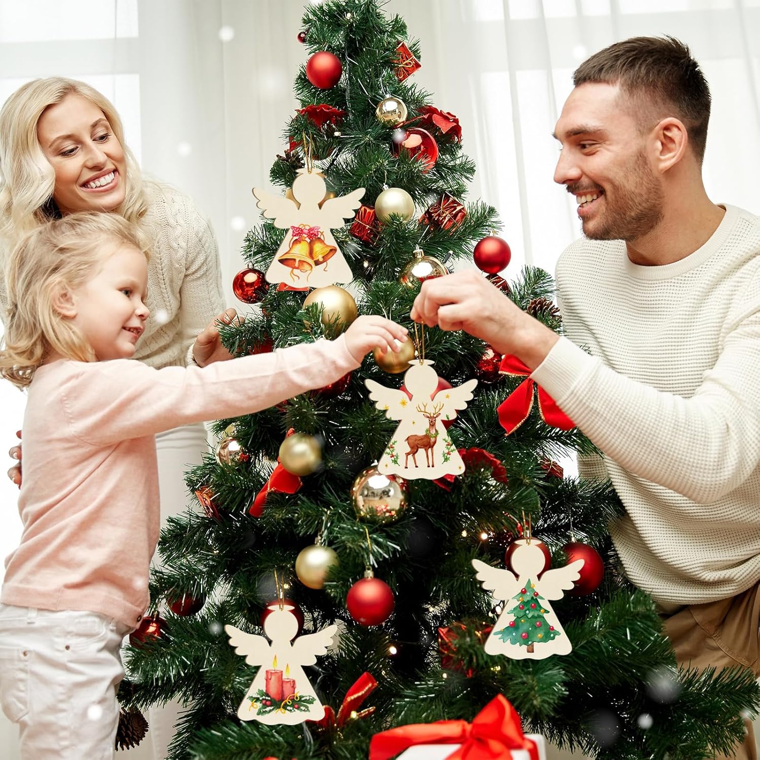 Family decorating a Christmas tree with ornaments and lights.