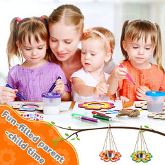 Woman and three children engaged in a craft activity with colorful materials.