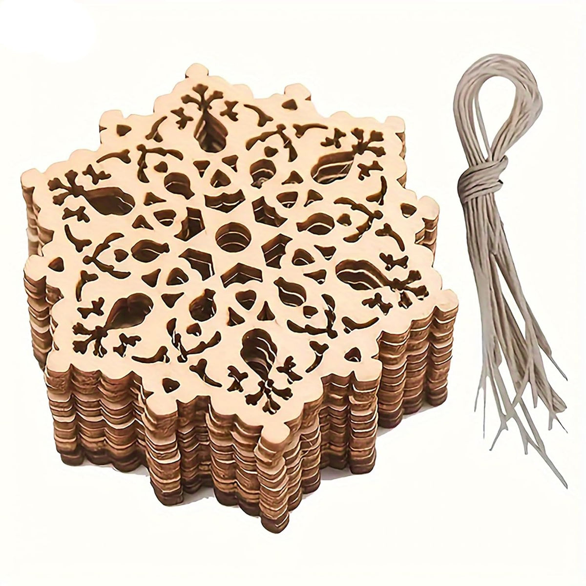 Stack of wooden coasters with intricate cut-out designs and a string on a white background