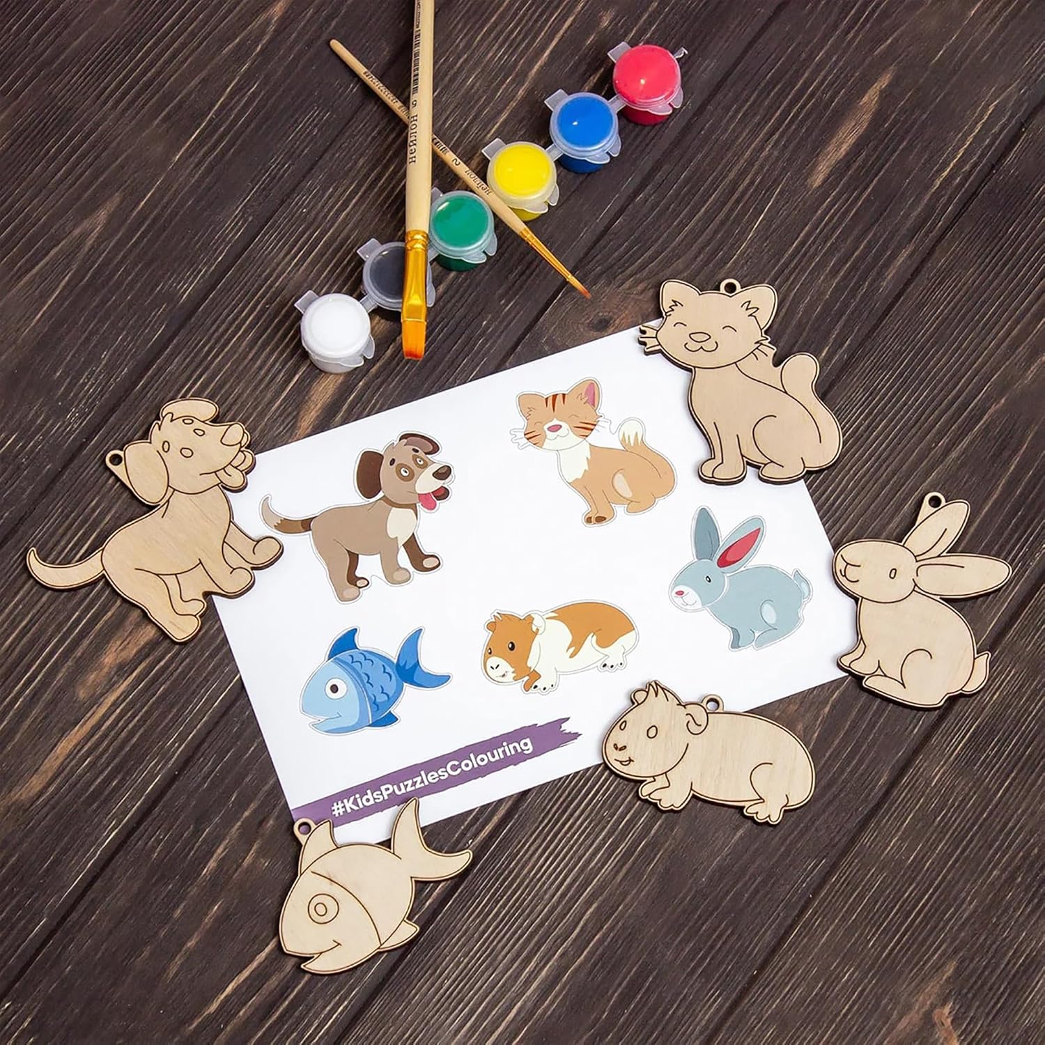 Wooden animal puzzles with coloring guide on a wooden surface