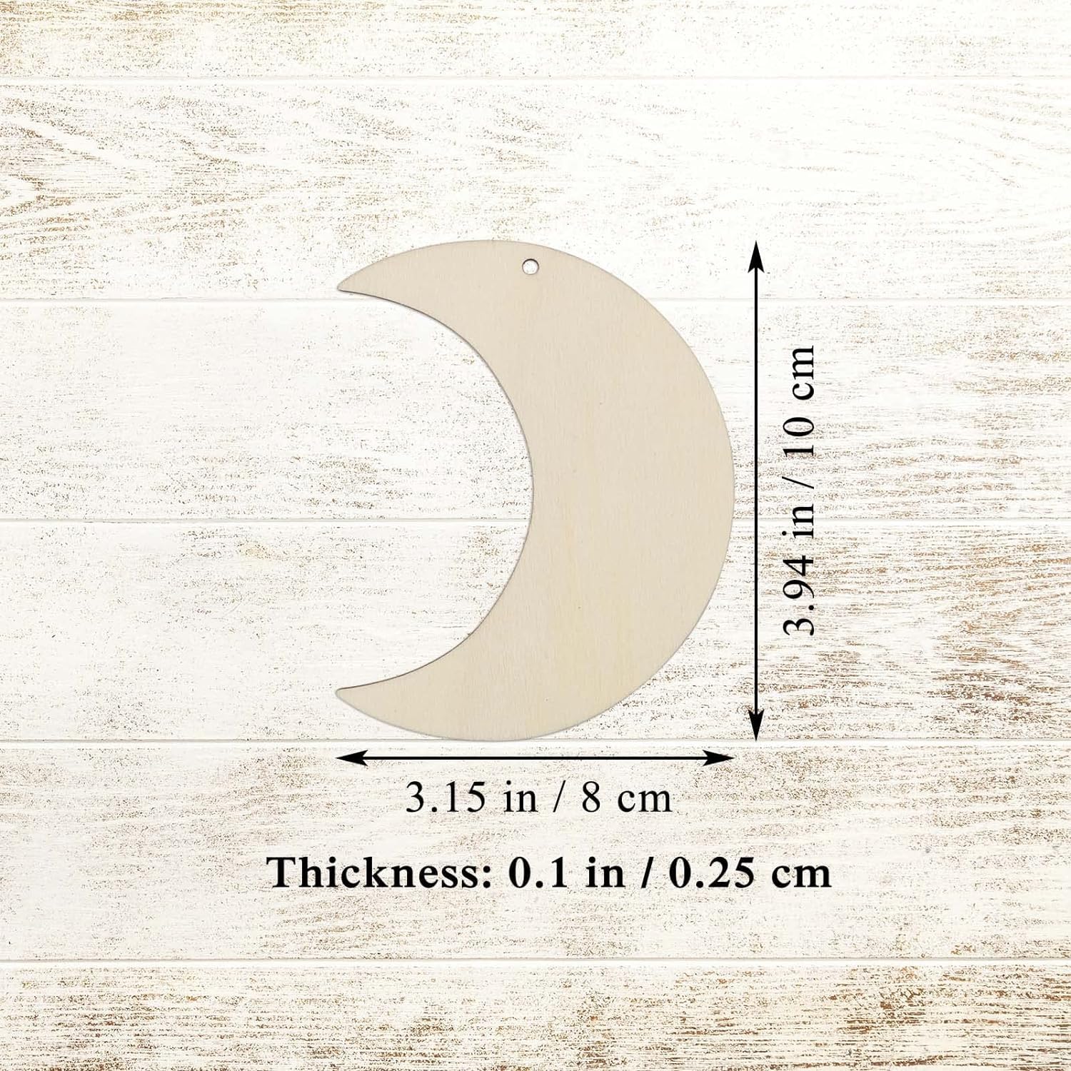 Moon-shaped wooden cutout with measurements on a textured beige background