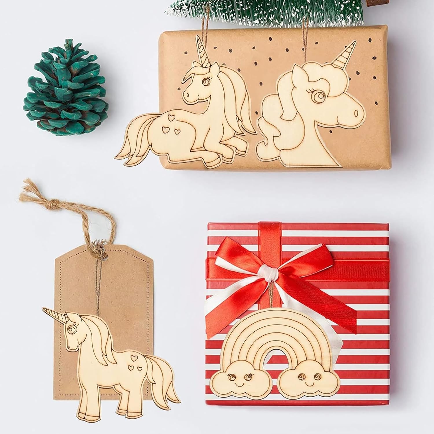 Wooden unicorn and rainbow decorations on gift boxes with a Christmas tree in the background.