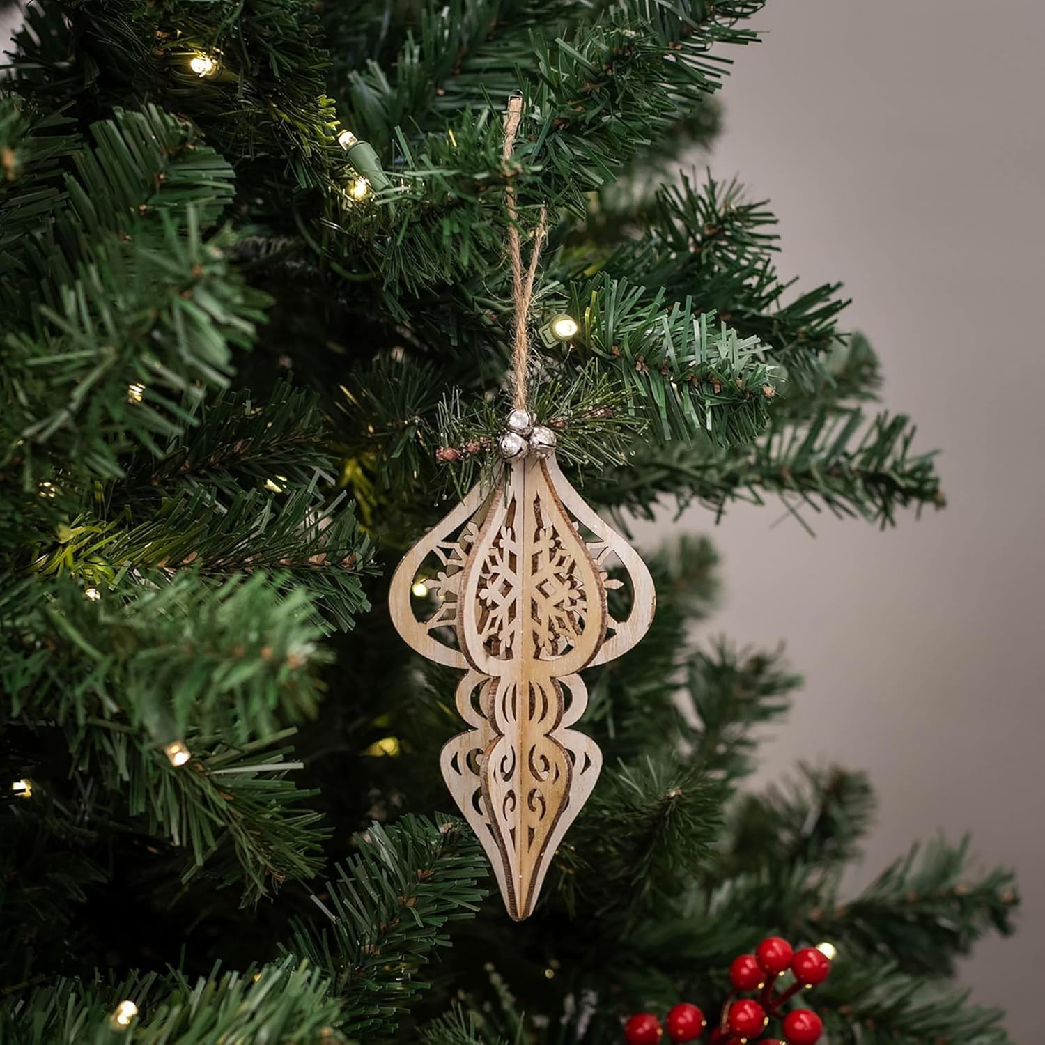 Wooden decorative ornament on a Christmas tree with a blurred background