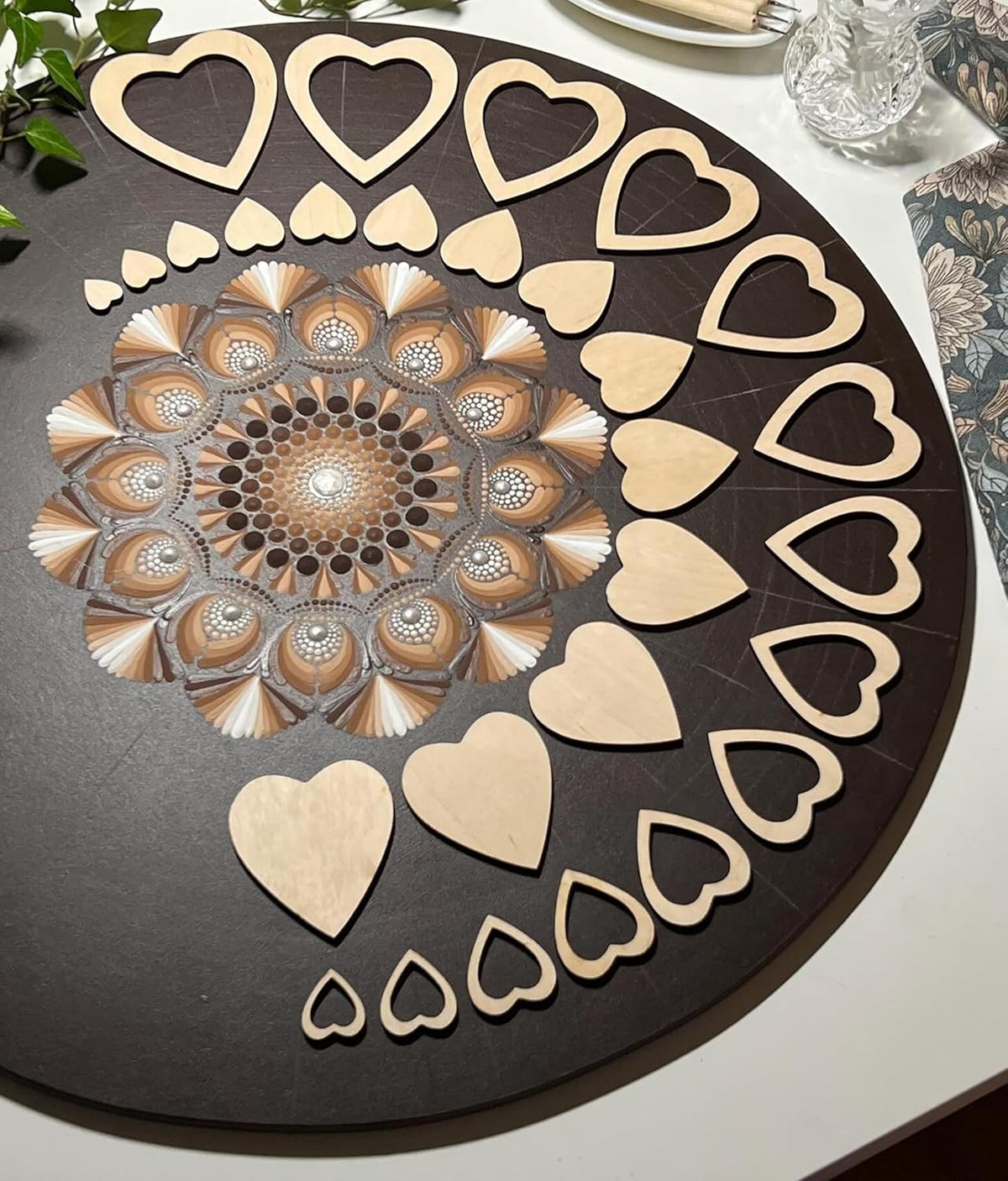 Decorative round mat with heart patterns on a table