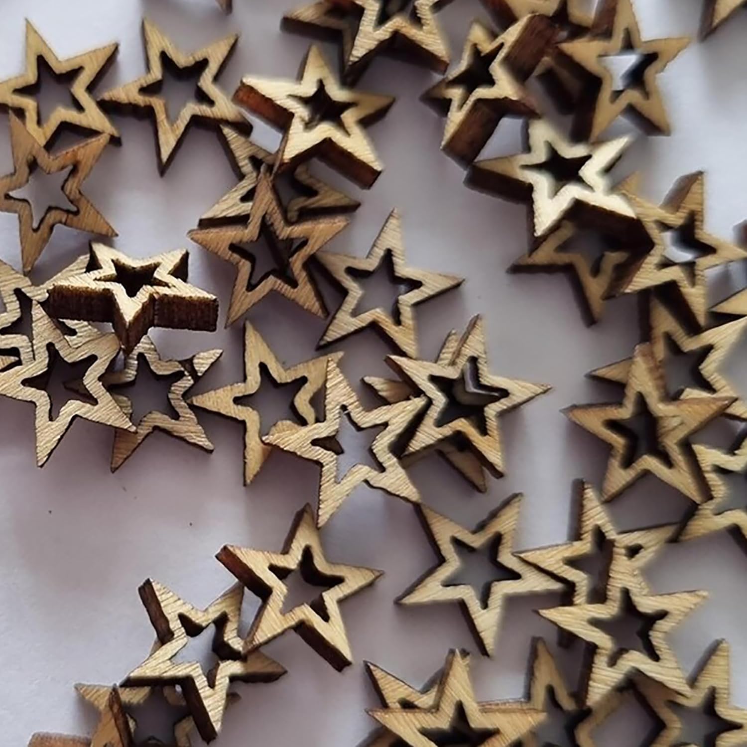 Collection of wooden star-shaped objects on a white background