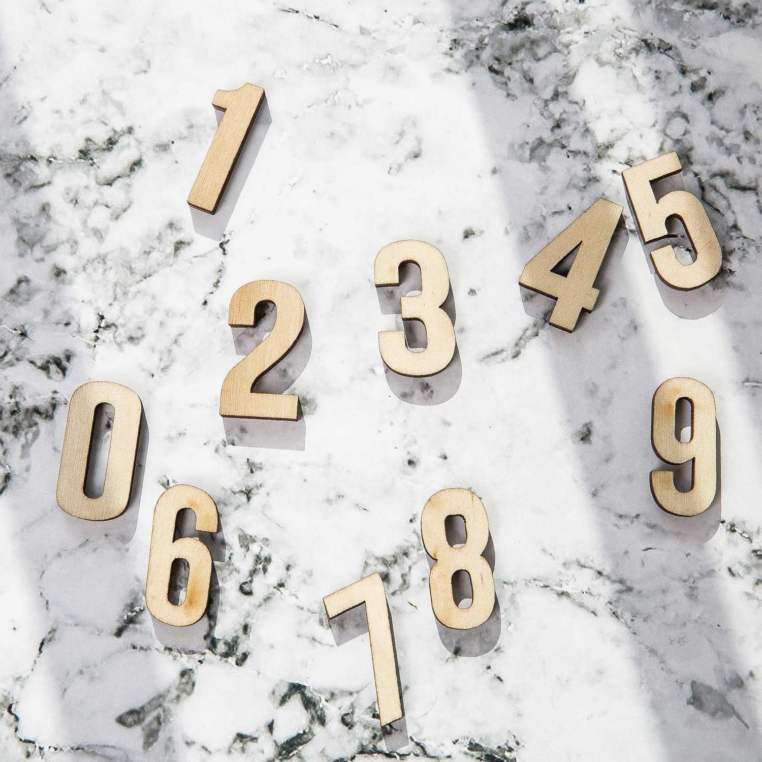 Wooden numbers on a marble background