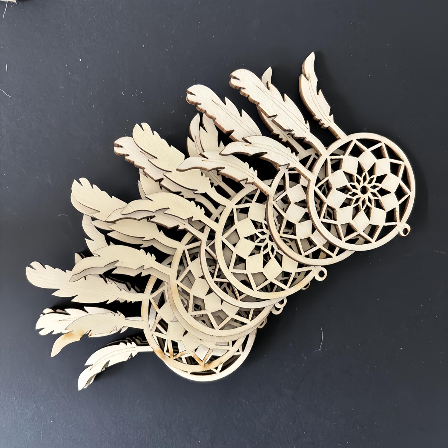 Wooden dreamcatcher ornament on a black background