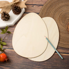 Two wooden round placemats with a pencil on a wooden surface, surrounded by decorative elements.