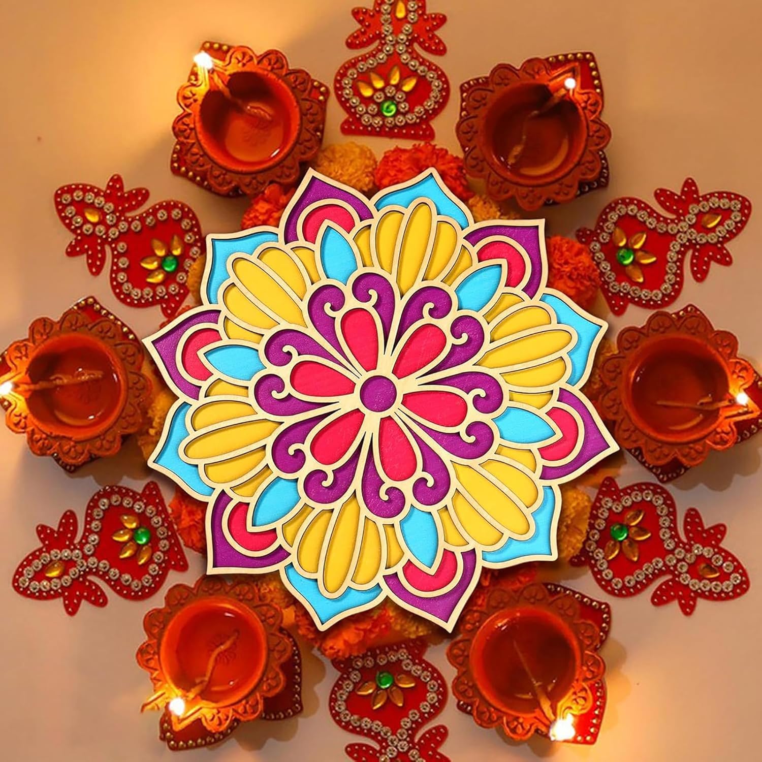 Colorful mandala design with lit Diwali lamps on a warm background