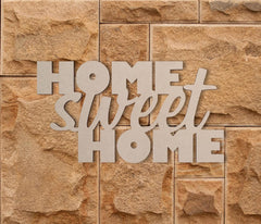 Decorative sign with 'Home Sweet Home' on a stone wall