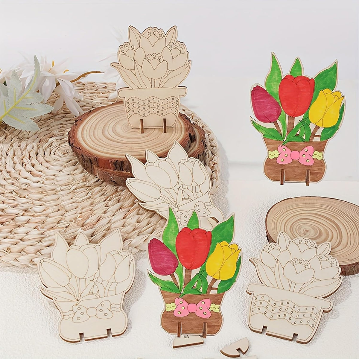 Wooden floral decorations on a white surface with a woven mat.