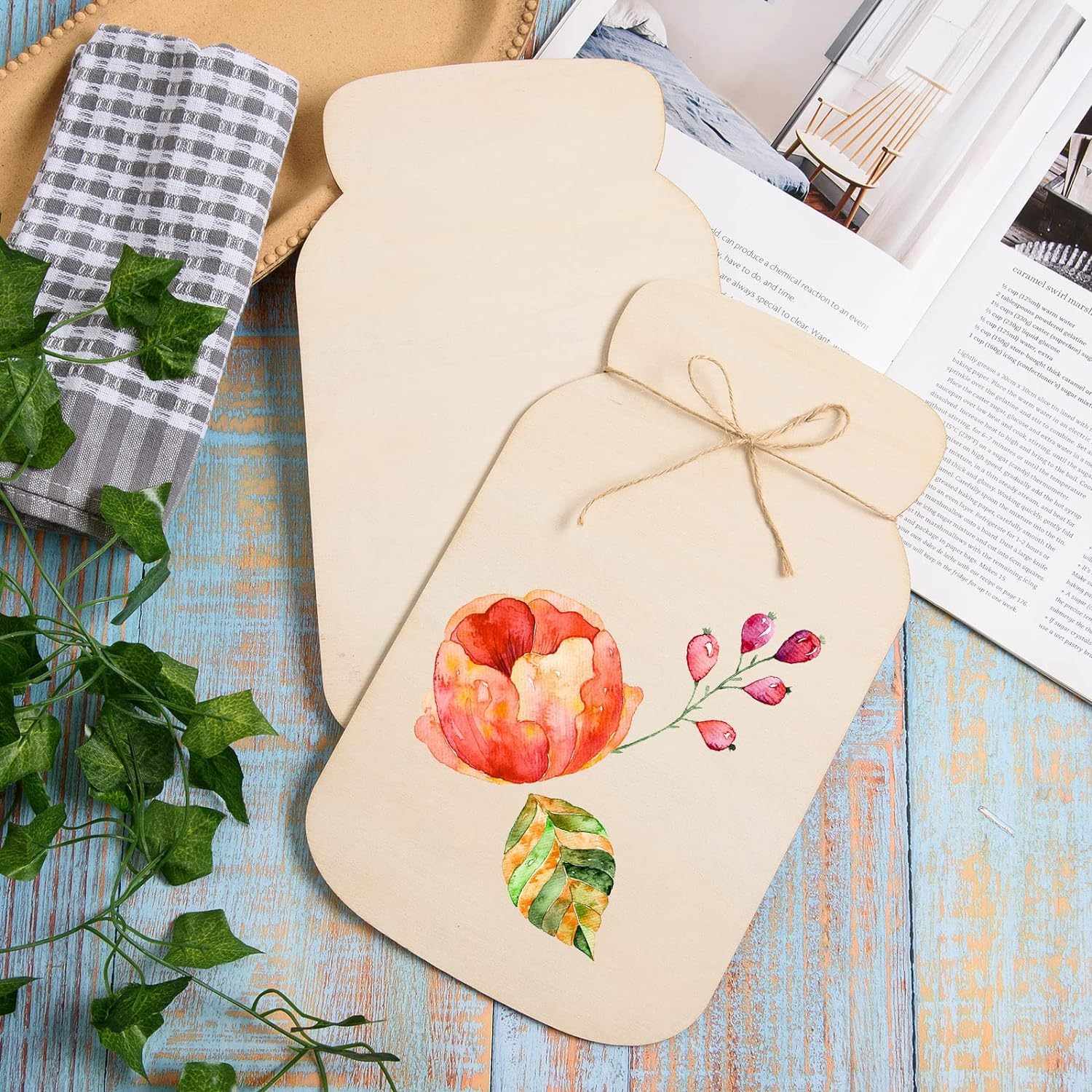 Beige hot water bottle cover with floral design on a wooden surface