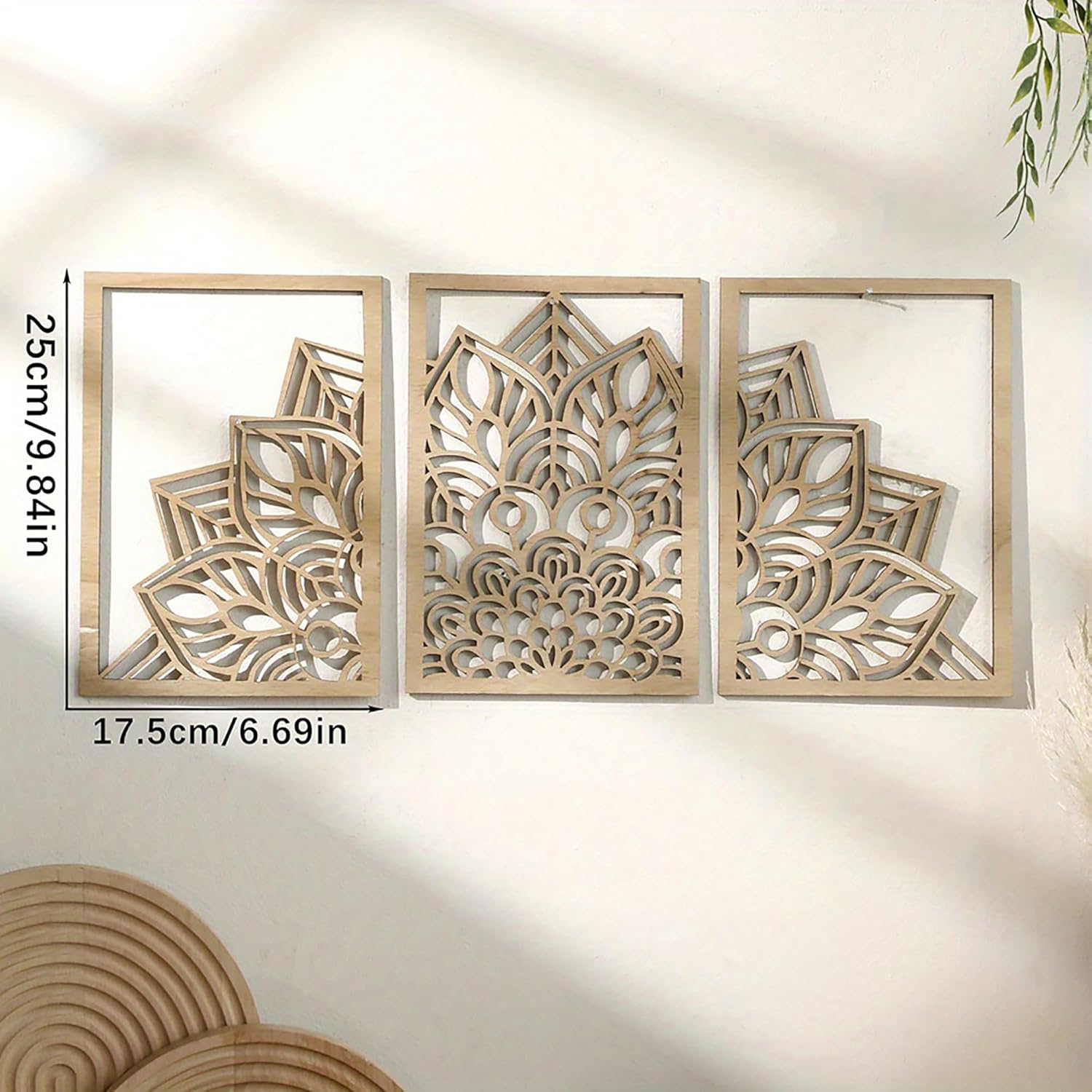 Three wooden wall art panels with geometric patterns on a plain background
