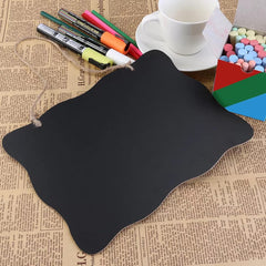 Black mouse pad on a newspaper background with stationery items.
