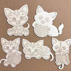 Five white cat-shaped cutouts on a brown background