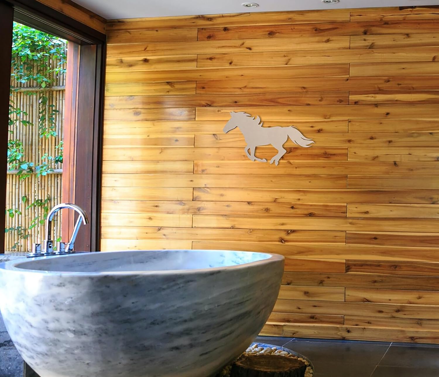Bathroom with a large stone sink against a wooden wall with a horse cutout.