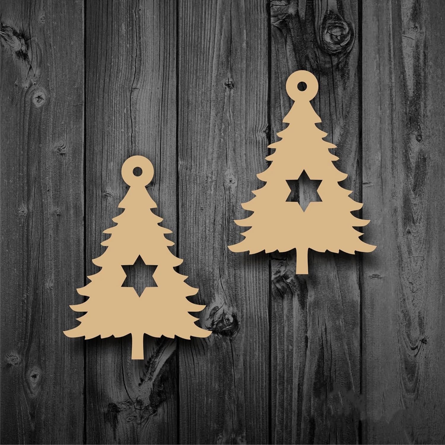 Two beige Christmas tree-shaped decorations on a wooden background
