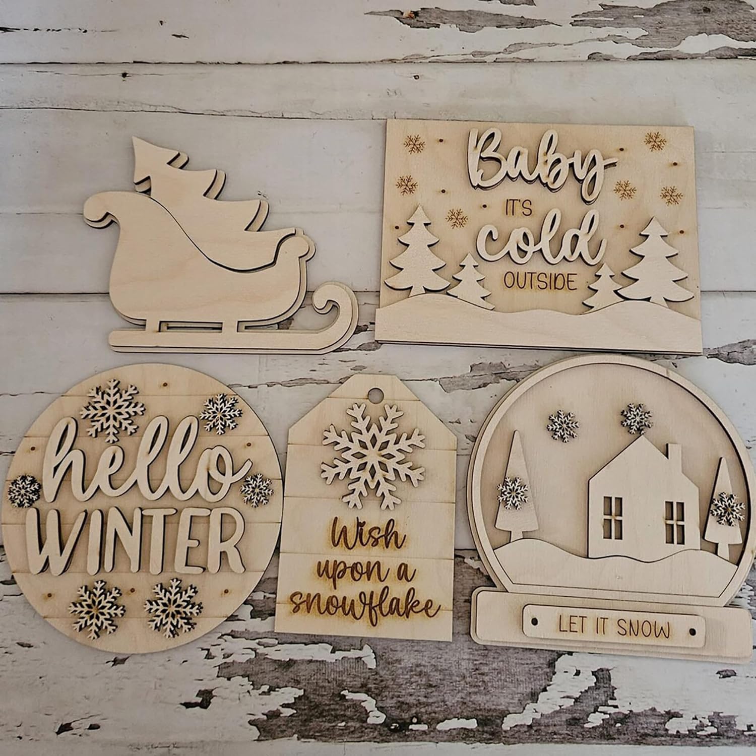 Set of wooden Christmas decorations on a rustic wooden background