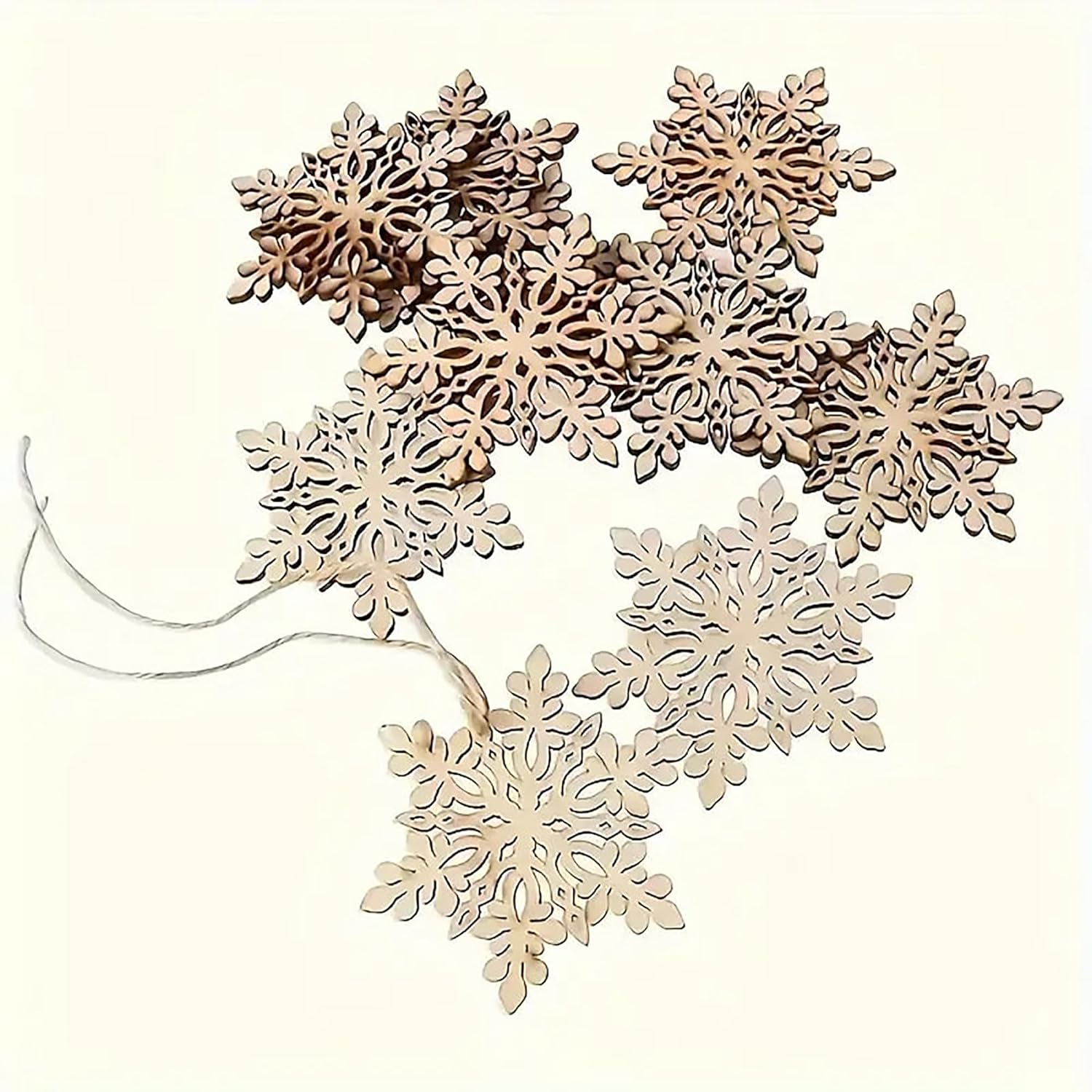 Wooden snowflake decorations on a white background