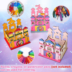 Colorful cardboard castle model with paint supplies on a purple background