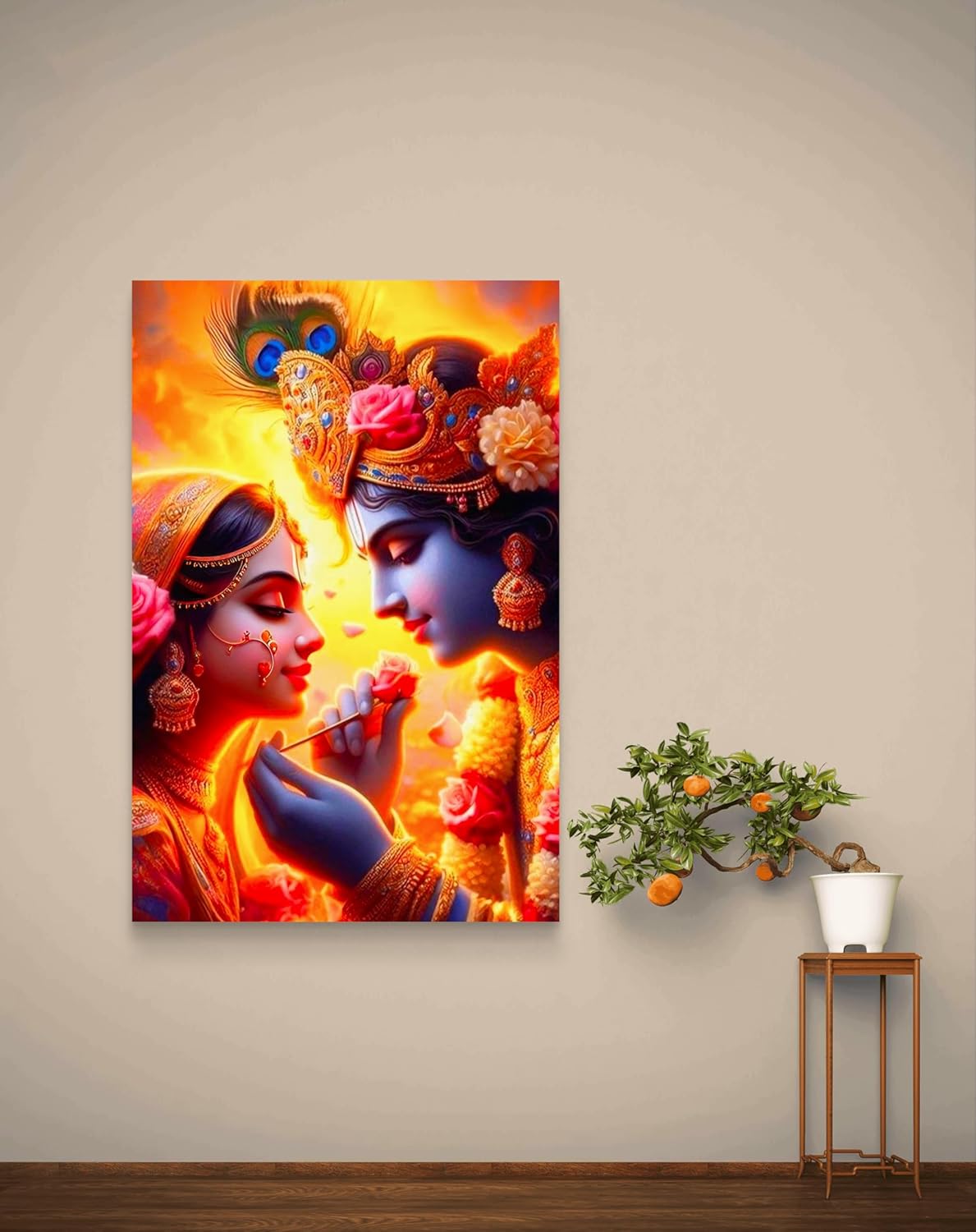 Colorful painting of two deities on a wall with a small table and plant in the foreground.