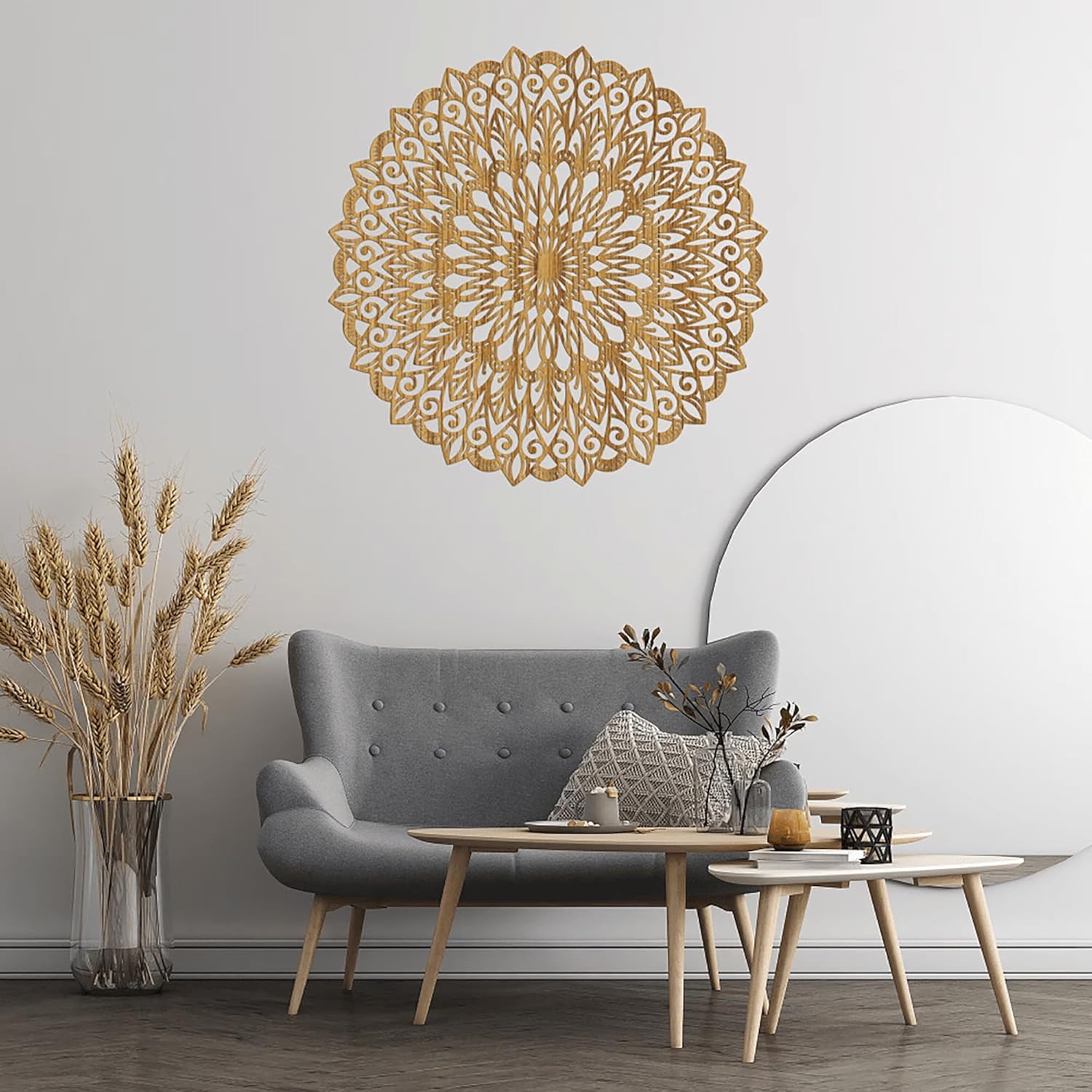 Living room with a decorative wall mandala, gray sofa, and wooden coffee table.