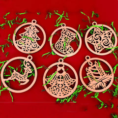Set of six wooden Christmas ornaments on a red background with greenery.