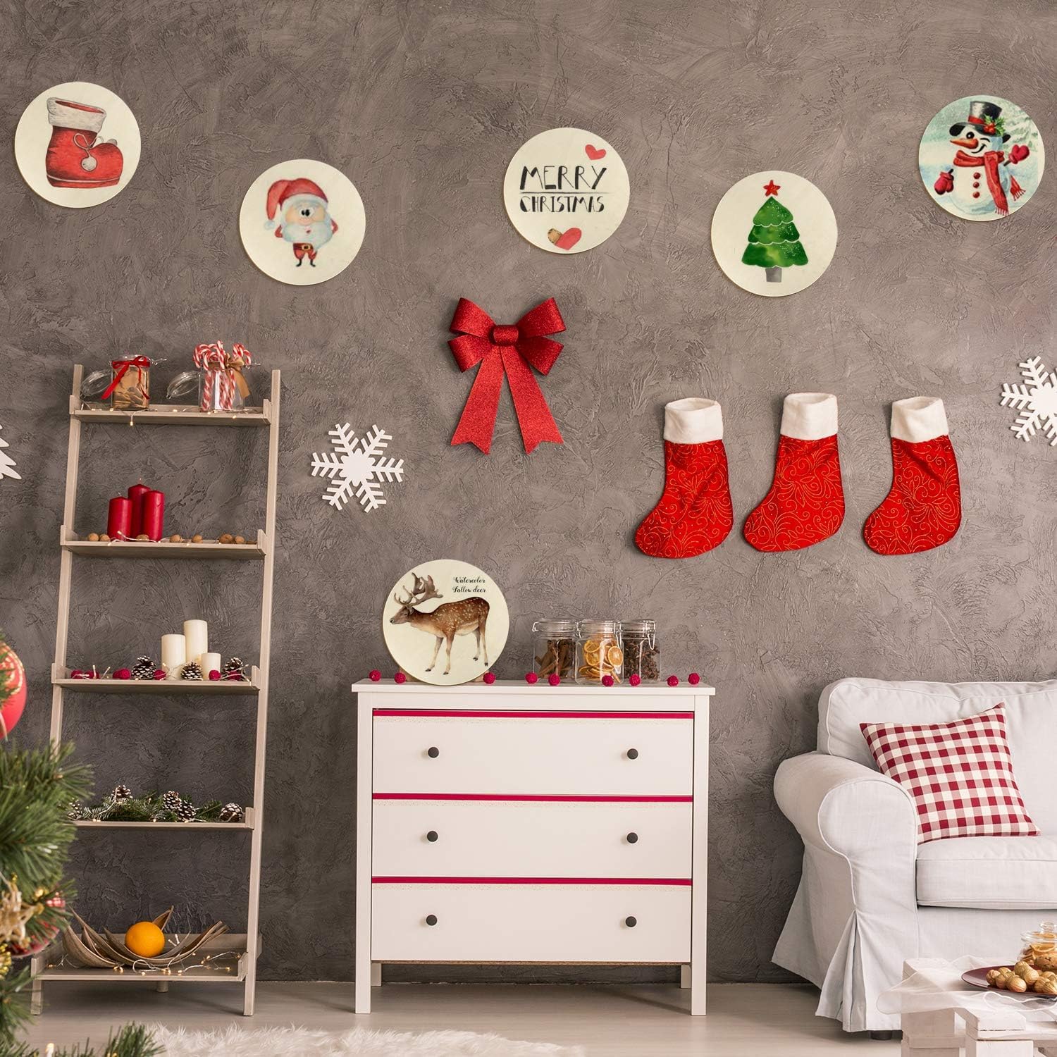 Decorative Christmas scene with stockings, shelves, and wall art on a gray wall.