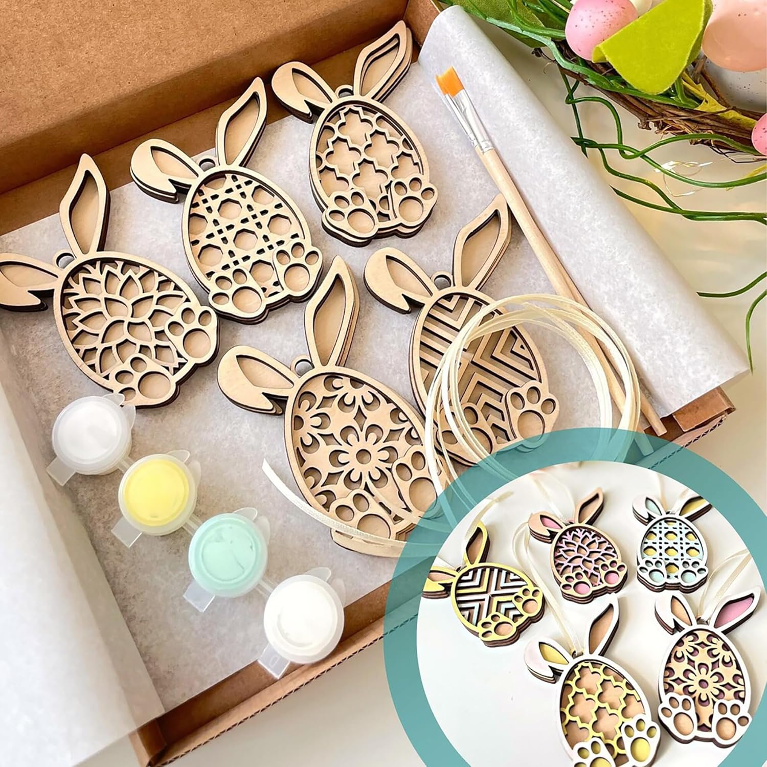 Decorative bunny-shaped metal stamps in a box with paint samples.