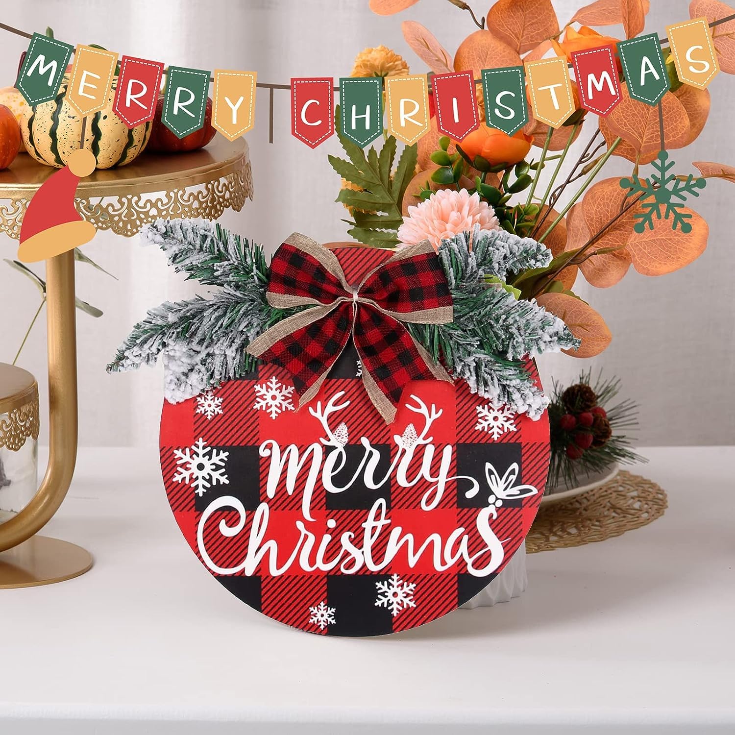 Decorative Christmas sign with plaid pattern and 'Merry Christmas' text, surrounded by festive decorations.
