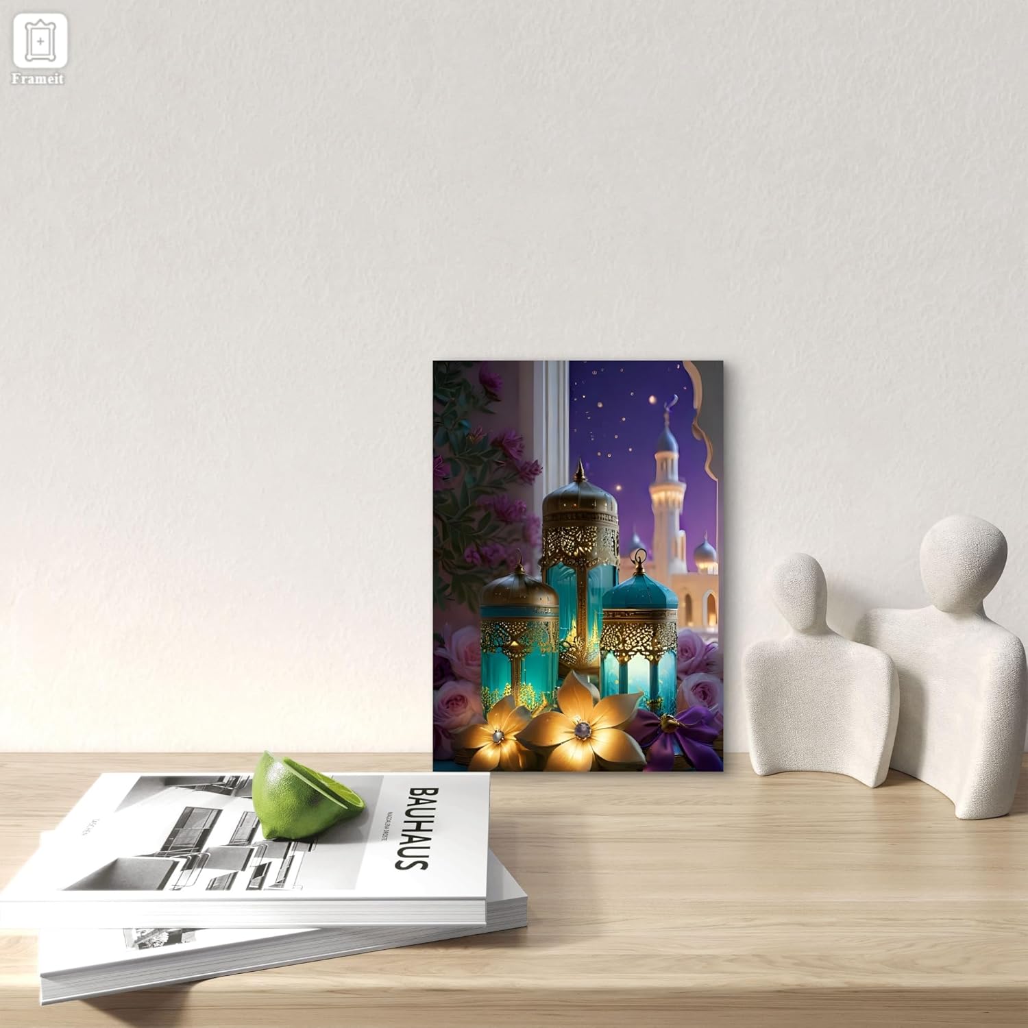 Decorative wall art with lanterns and flowers on a wooden surface with books and sculptures.