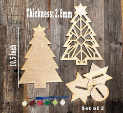 Wooden Christmas tree and star decorations with paint supplies on a wooden background