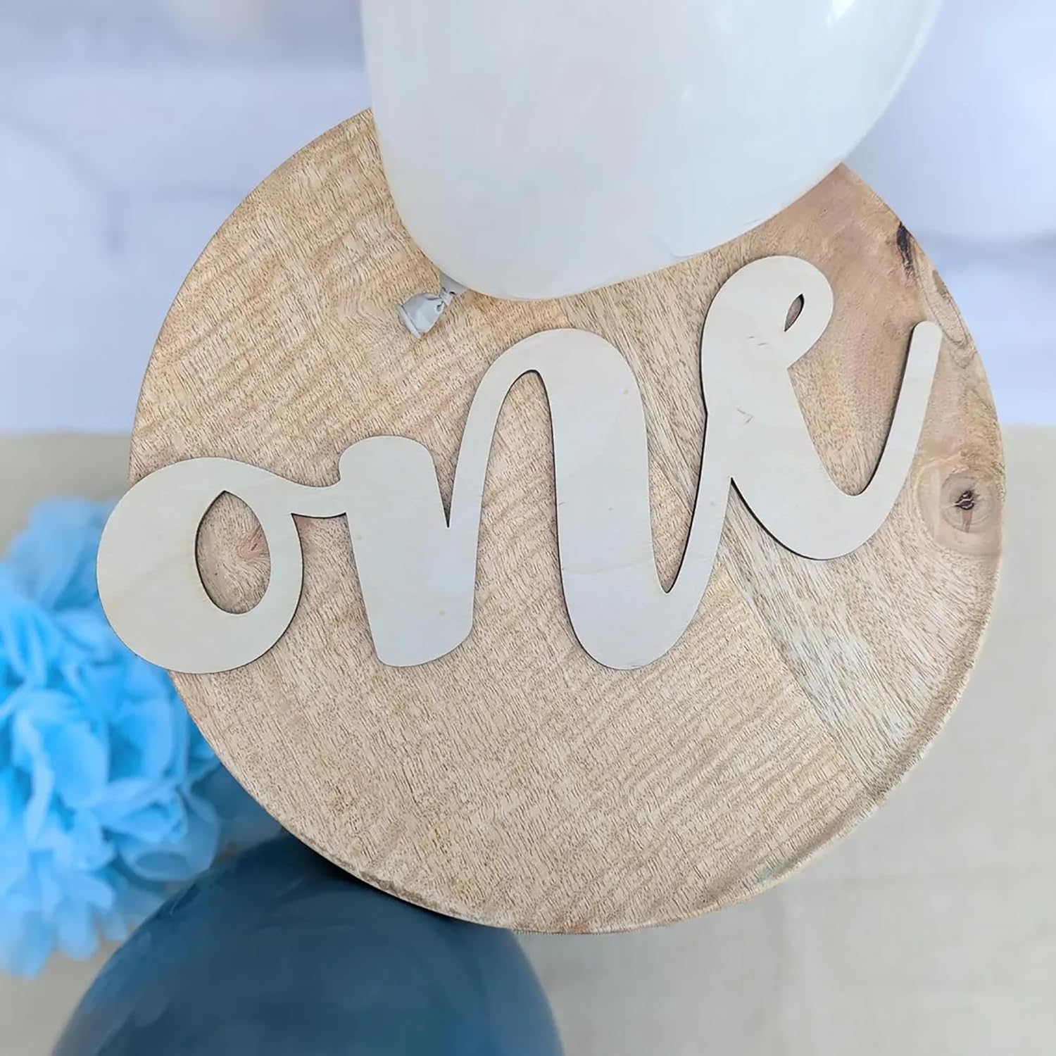 Wooden plaque with 'one' on a blurred background
