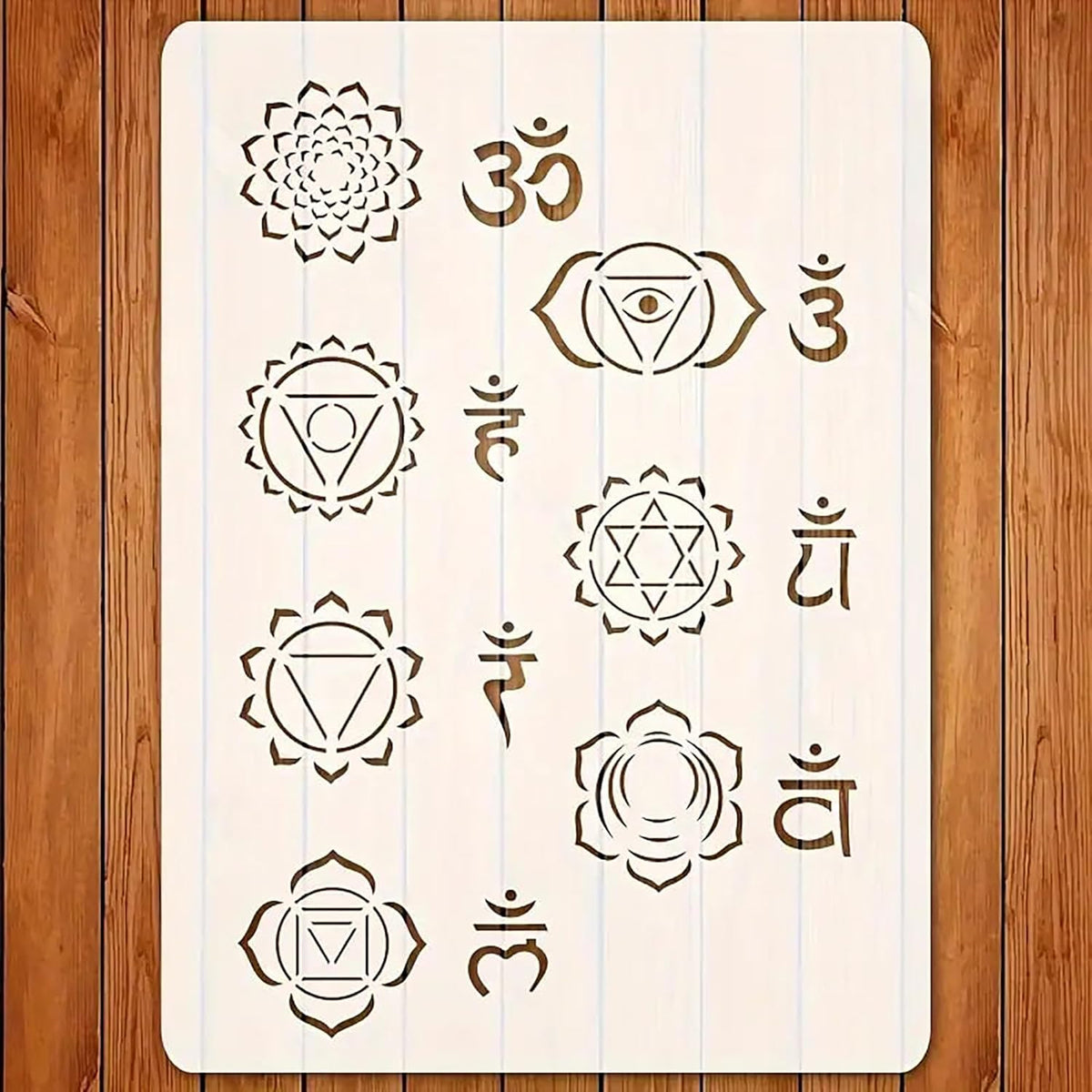 Sheet of stencils with various symbols on a wooden surface