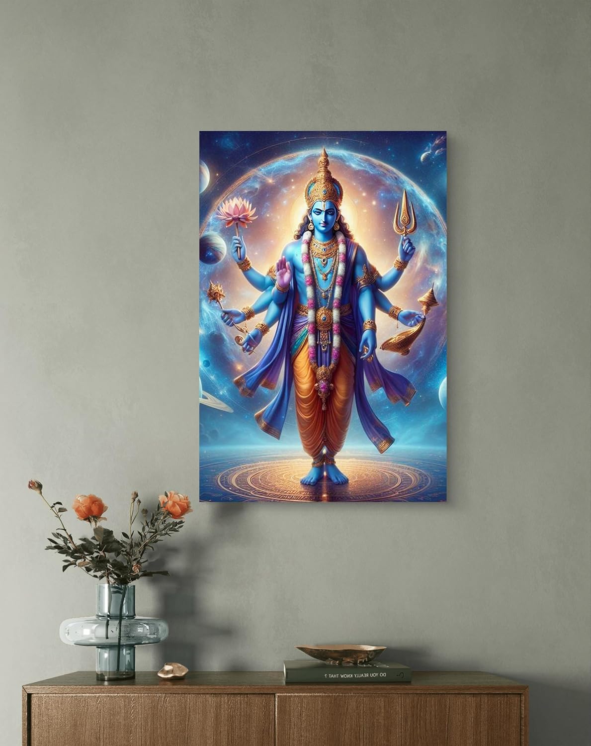 Colorful depiction of a deity on a wall above a wooden cabinet with decorative items.