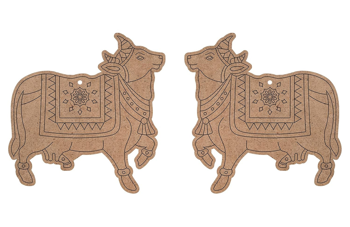 Two decorative cow-shaped items with intricate patterns on a white background