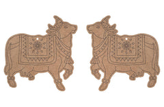 Two decorative cow-shaped items with intricate patterns on a white background