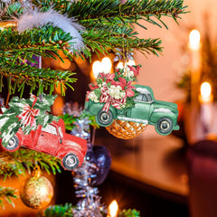 Decorative Christmas ornaments of vintage trucks on a lit Christmas tree with warm background.