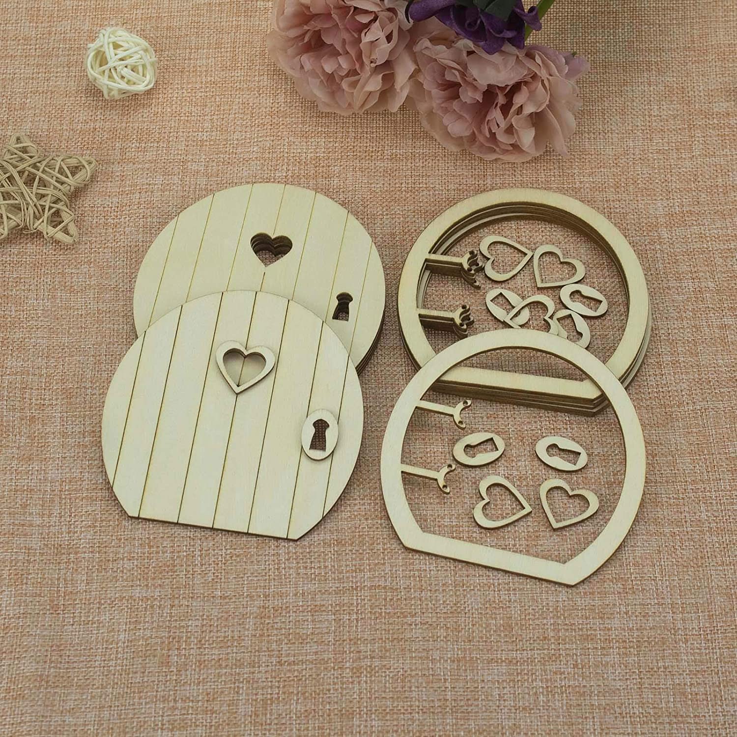 Wooden fairy door with heart-shaped lock and key on a textured fabric background