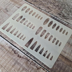Decorative metal vent cover with cut-out design on a wooden surface