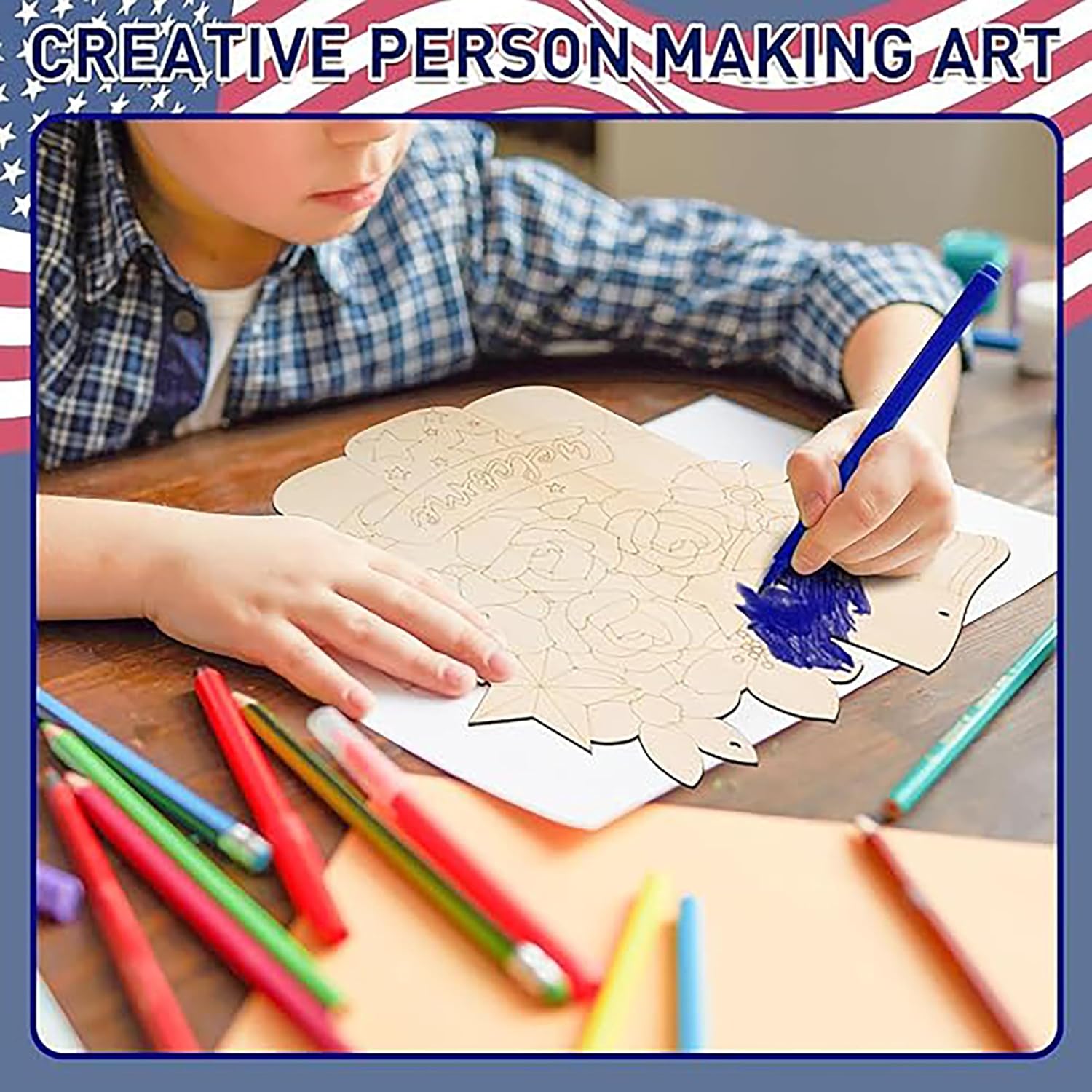 Person making art with colored pencils on a wooden table, surrounded by colorful pencils.