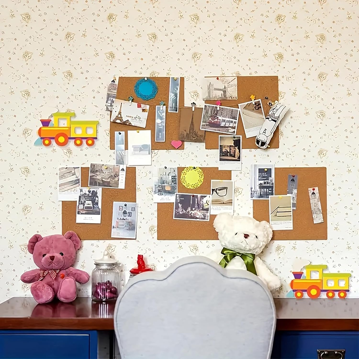 Children's room with a bulletin board, teddy bears, and toys on a floral wallpapered wall.