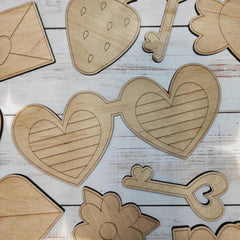 Wooden cutouts of various shapes on a wooden surface